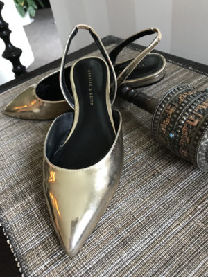 Stylish, comfortable shoes for women over 40: gold flats with sling backs 