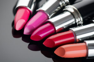 Women's accessories: Lipsticks on black background