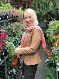 Winter style tips: woman wearing a sand coloured leather jacket.