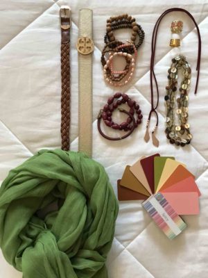Two belts, three necklaces, two rings, assorted fun bracelets and a scarf complete the travel packing capsule wardrobe.