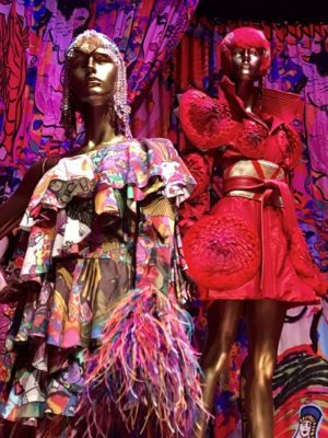 Mannequins wearing colourful dresses.