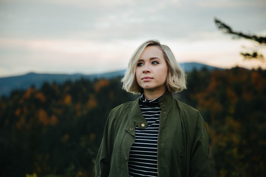 Woman wearing forest green jacket