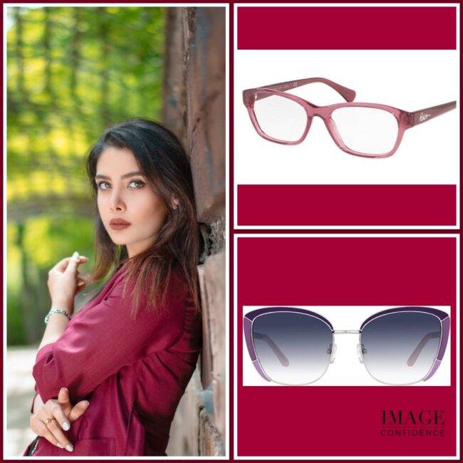 Woman wearing maroon top with two pairs of glasses that suit her cool colouring.