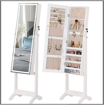 A large white free-standing jewellery cabinet. It has some pieces of jewellery in it and it has a full length mirror on the front.