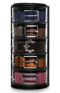 A black cylindrical belt storage unit. There are 5 different coloured belts in the organiser.