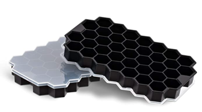 Two black hexagonal ice trays with translucent lids. These will be used as an inexpensive earring holder