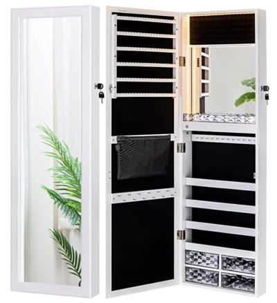 Large white jewellery cabinet is hung on a wall. The cabinet is empty.