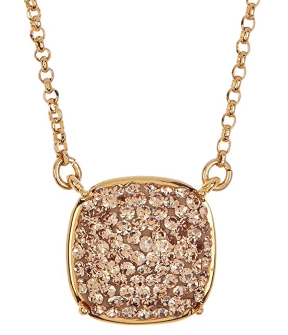 Yellow gold soft square pendant necklace by Kate Spade. Beautiful glittering cubic zirconias are pave set on the square shape.