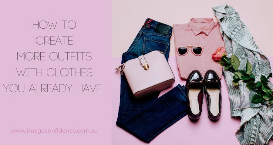 This is a flatlay photo of clothes. It consists of dark blue jeans, a pink blouse and bag, patent leather brogues, and a patterned scarf. The text is, 'How to Create More Outfits With Clothes You Already Have.' This is the title of the blog.